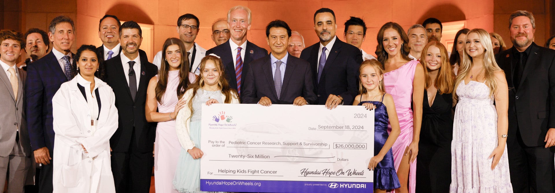helping kids fight cancer foundation showing their big check from hyundai hope on wheels - Diamond Hyundai Palmdale in Palmdale CA